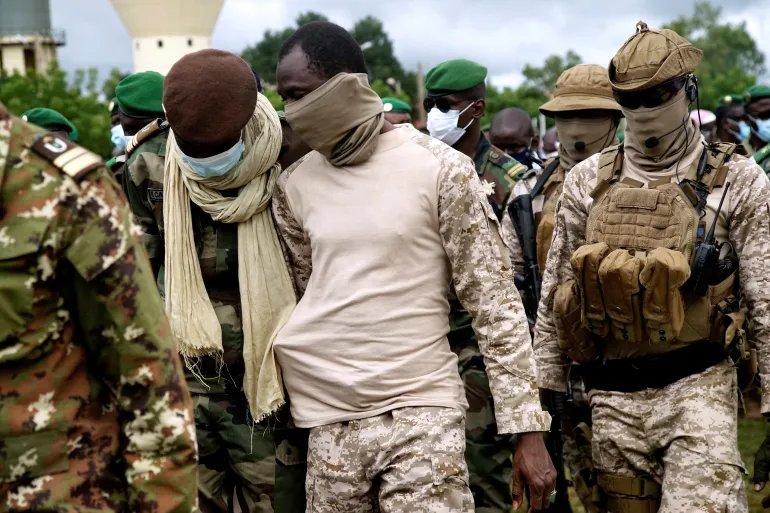 Colonel Assimi Goita, head of Mali's military government, attends a ceremony for the 10 Malian soldiers that the army said were killed in attacks in Gueri town, at the army headquarters in Kati, Mali, September 6, 2020 [Matthieu Rosier/Reuters]