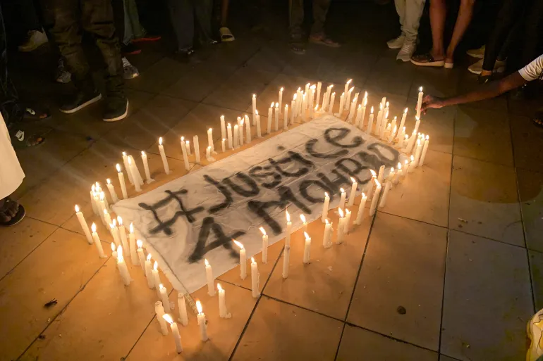 People gather for a candlelight procession for late Nigerian singer, Mohbad, in Lekki, Lagos, Nigeria September 21, 2023. [Seun Sanni/Reuters]