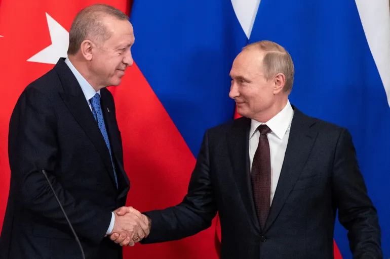 Russian President Vladimir Putin, right, and Turkish President Recep Tayyip Erdogan shake hands during a news conference following their talks in Moscow on March 5, 2020 [File: Pavel Golovkin/Pool via Reuters]