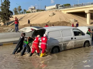 Members of Libya’s Red Crescent recovering vehicles from the floods [Handout/Libya Red Crescent via EPA]