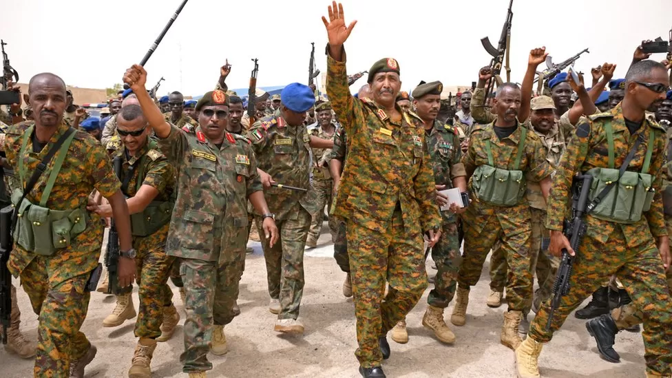 Gen Abdel Fattah al-Burhan (centre) says he is "definitely" confident of defeating the RSF rebels