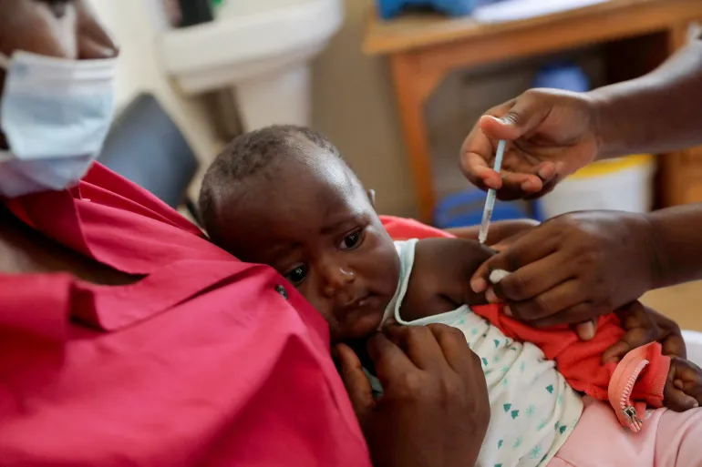 A nurse administers the malaria vaccine to an infant at the Lumumba Sub-County Hospital in Kisumu, Kenya [File: Baz Ratner/Reuters]